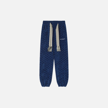Front view of the blue Urban Nomad Jogger Pants in a gray background