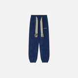Front view of the blue Urban Nomad Jogger Pants in a gray background