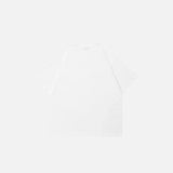 Back view of the white Splashing Milk Star Graphic T-shirt in a gray background