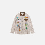 Front view of the apricot Embroidered Patch Patter Shirt in a gray background