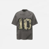 Front view of the grey Vintage Grunge Patch T-Shirt in a gray background