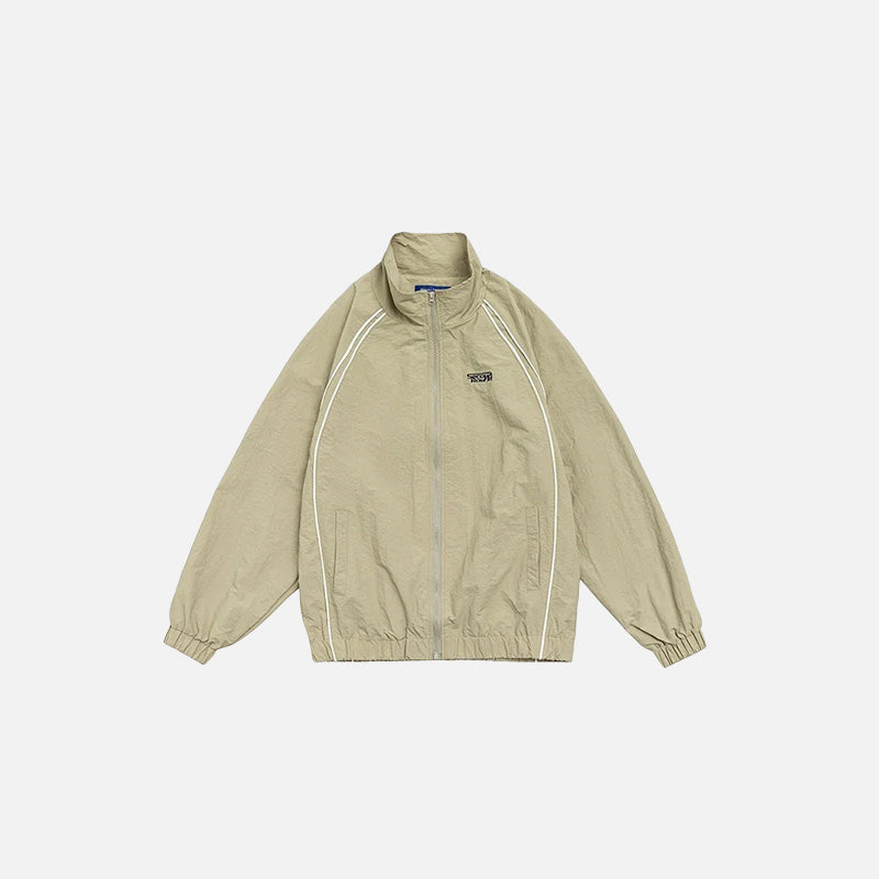 Front view of the khaki Vintage Striped Varsity Jacket in a gray background 