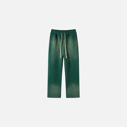 Front view of the dark green Casual Noir Relax Pants in a gray background