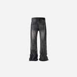 Back view of the black gray Vintage Rebel Jeans in a gray background