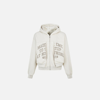 Front view of the apricot Motivational Zip-Up Hoodie in a gray background