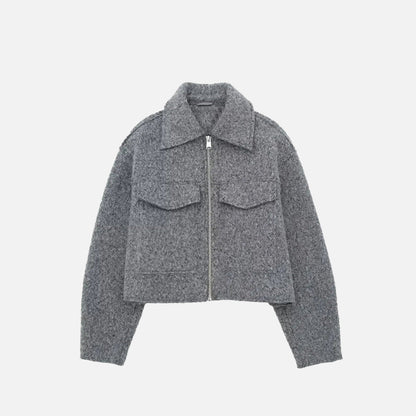 Front view of the grey Quilted Utility Jacket in a gray background
