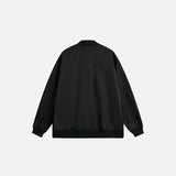 Back view of the black Steller Design Jacket in a gray background