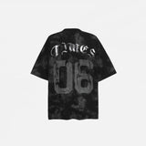 Back view of the black Vintage Graphic Printed Grunge T-Shirt in a gray background