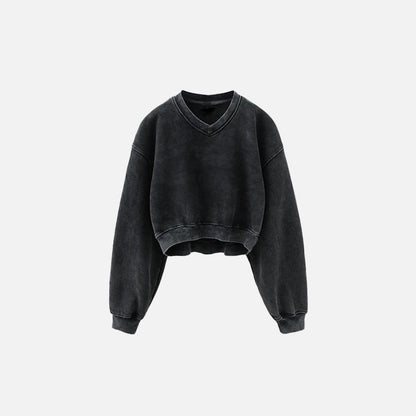 Front view of the black Women's Fleece Cropped Sweatshirt in a gray background 