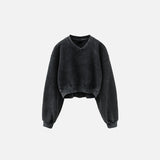 Front view of the black Women's Fleece Cropped Sweatshirt in a gray background 