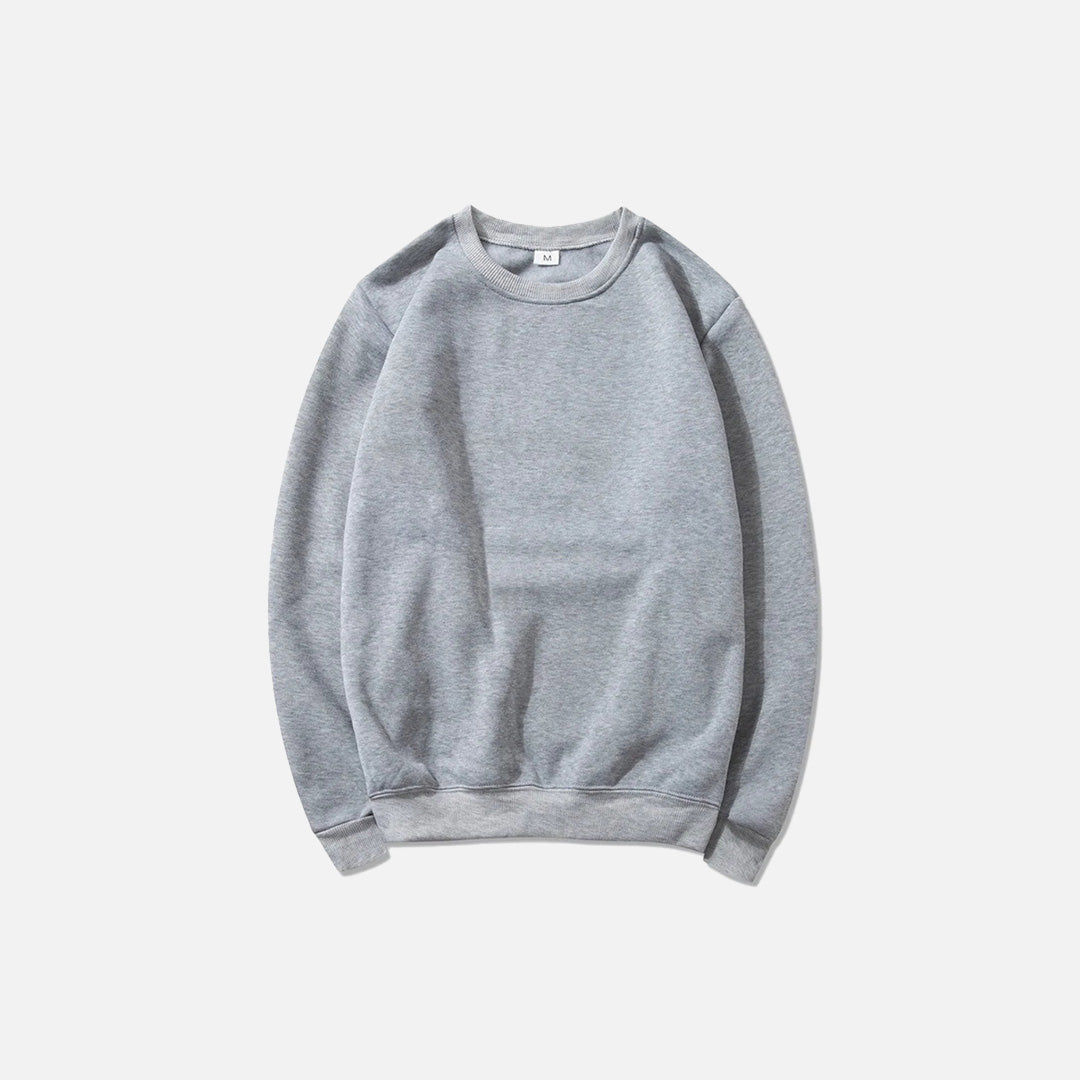 Front view of the light gray Essential Pullover Sweatshirt in a gray background