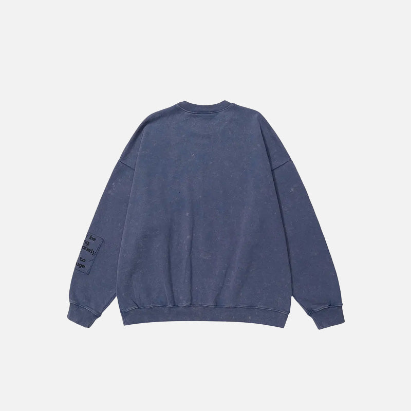 Back view of the purple Urban Patchwork Sweatshirt in a gray background