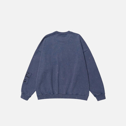 Back view of the purple Urban Patchwork Sweatshirt in a gray background