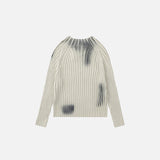 Back view of the beige Loose Ripple Knitted Sweater in a gray background