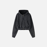 Front view of the washed black Women's Fleece Zip-up Hoodie in a gray background 