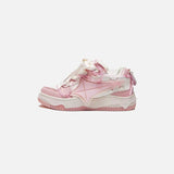 Side view of the pink Galaxy Wave Sneakers in a gray background
