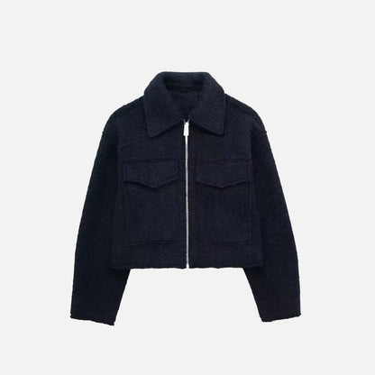 Front view of the navy blue Quilted Utility Jacket in a gray background