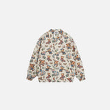 Front view of the apricot Teddy Pop Jacket in a gray background