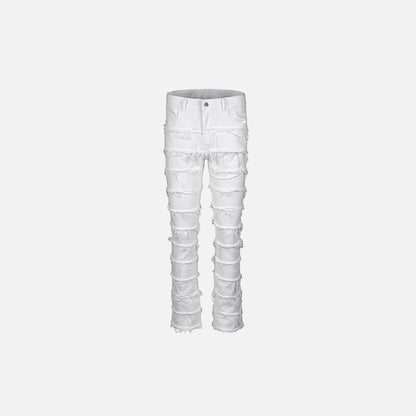 Front view of the white Distressed Patchwork Skinny Jeans in a gray background