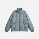 Front view of the blue High-Neck Puffer Jacket in a gray background