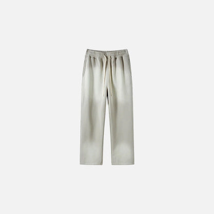 Front view of the dark grey Casual Noir Relax Pants in a gray background