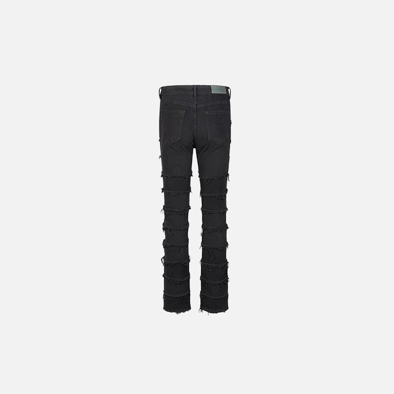 Back view of the black Distressed Patchwork Skinny Jeans in a gray background