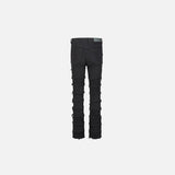 Back view of the black Distressed Patchwork Skinny Jeans in a gray background