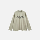 Front view of the green Motivational Long-Sleeve T-shirt in a gray background