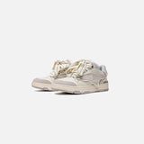 Front view of the white Star Runner Classic Sneakers in a gray background