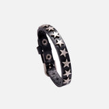 Front view of the black Star-Studded Leather Bracelet in a gray background
