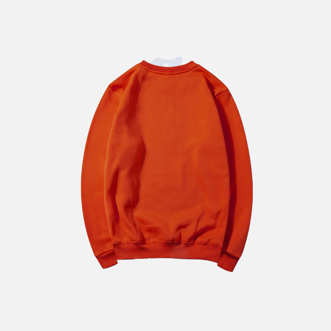 Back view of the orange Essential Pullover Sweatshirt in a gray background