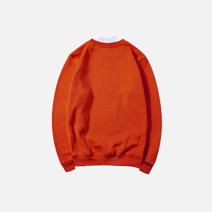 Back view of the orange Essential Pullover Sweatshirt in a gray background
