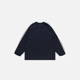 Back view of the blue Heritage Stripe Long Sleeve T-shirt in a gray background