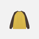 Back view of the yellow Balance Clube Sweater in a gray background