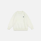 Front view of the beige Classic Cozy Knit Sweatshirt in a gray background