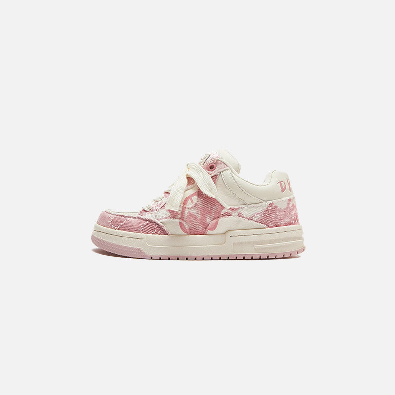 Front view of the pink Flow Striders Sneakers in a gray background