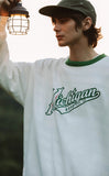 A guy wearing Michigan sweatshirt