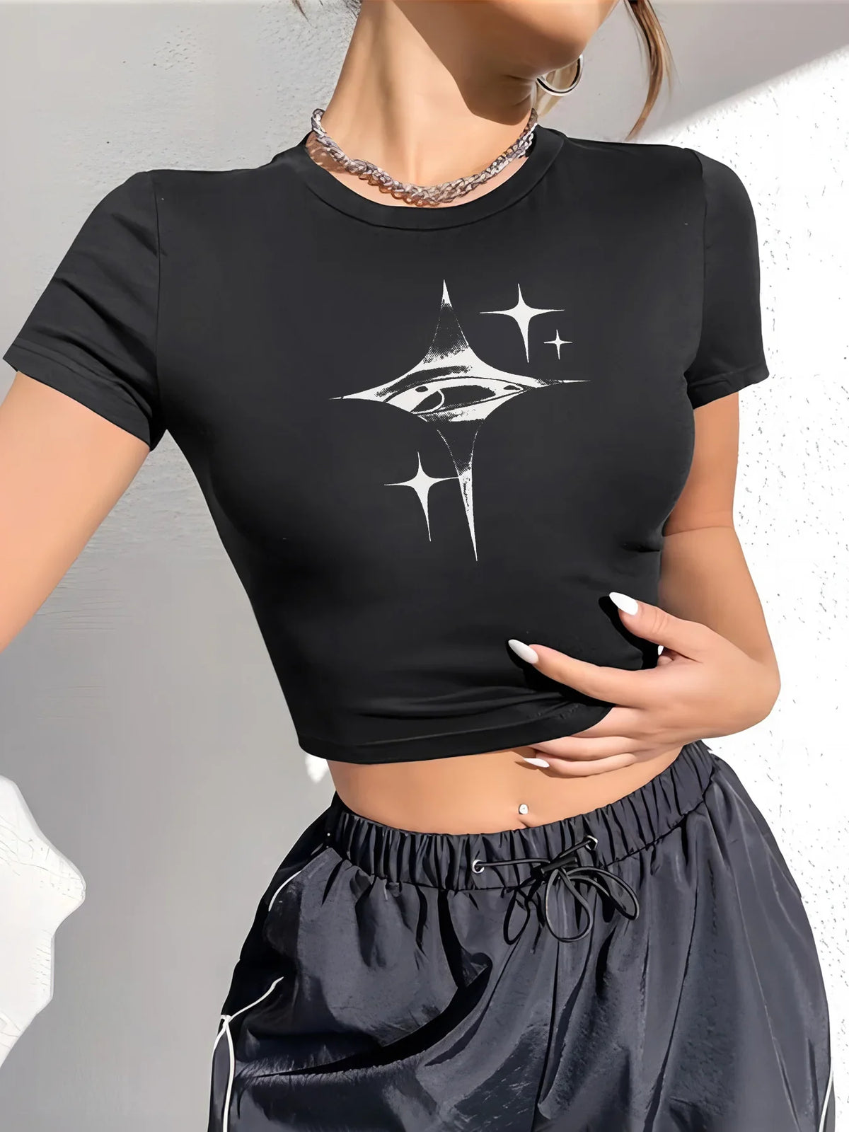 Model wearing the black Starburst Crop Top 