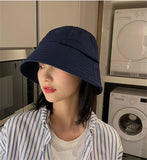 Model wearing the navy blue Urban Explorer Bucket Hat