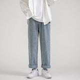 White long-sleeve shirt, wide light blue jeans, white Nike shoes, clean white background.