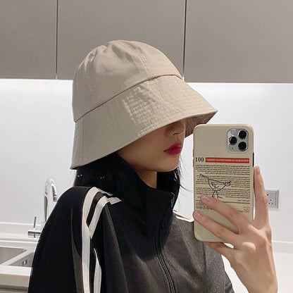 Model wearing the beige Urban Explorer Bucket Hat