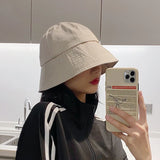 Model wearing the beige Urban Explorer Bucket Hat