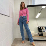 Model wearing the rose red Timeless Knitwear Sweater