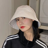 Model wearing the white Urban Explorer Bucket Hat