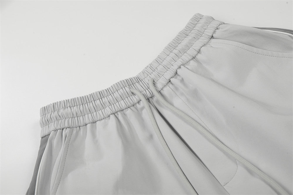 DAXUEN Wide-leg track pants with geometric color-blocked panels
