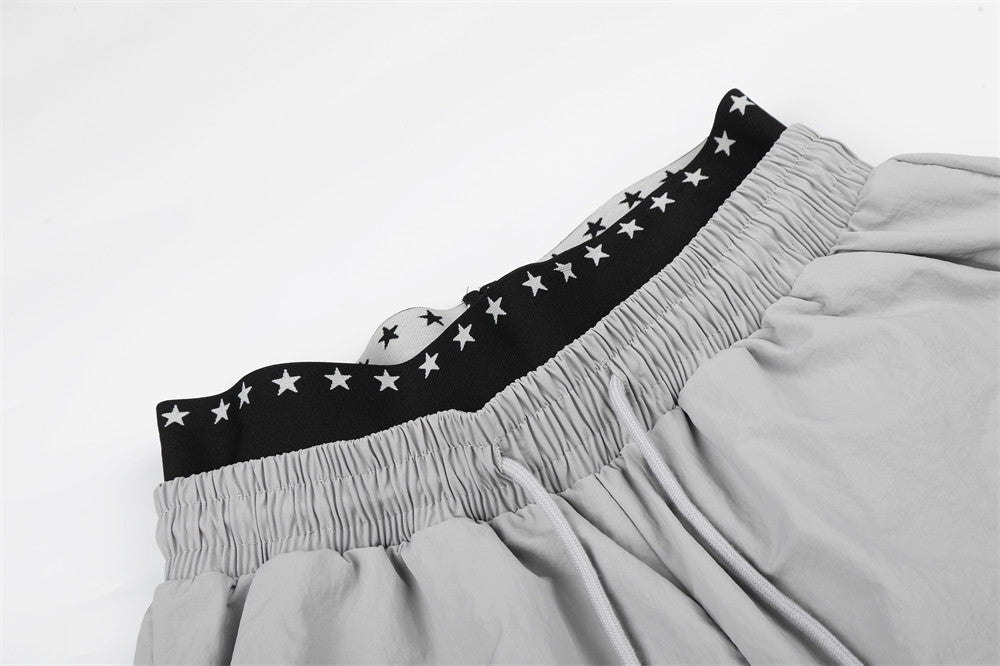 DAXUEN Wide-leg track pants with star graphics