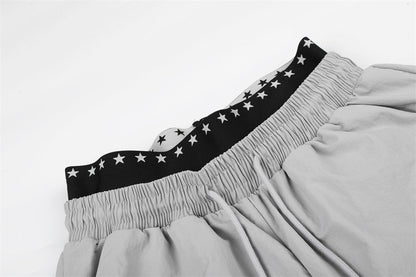 DAXUEN Wide-leg track pants with star graphics