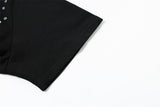 DAXUEN Short-sleeved black t-shirt with metal eyelet graphic