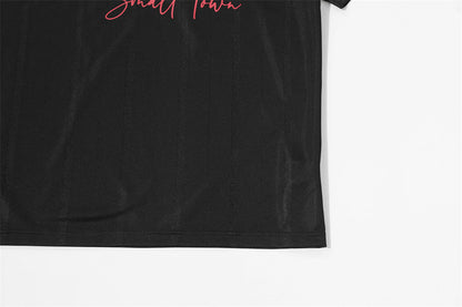 DAXUEN V-neck short-sleeved jersey top with graphic elements