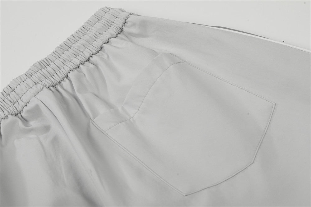 DAXUEN Wide-leg track pants with geometric color-blocked panels